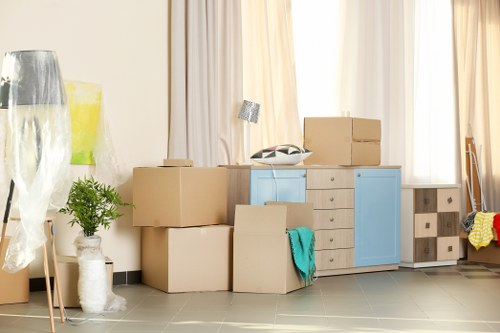 Removal team preparing a home move in Fulham with boxes and furniture