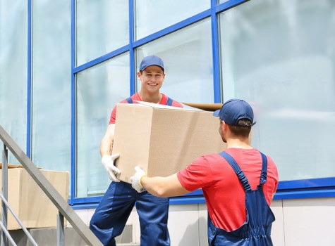 Commercial moving team preparing office relocation equipment in Fulham
