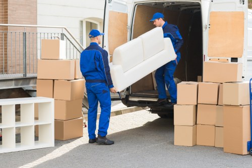 Office relocation planning in Fulham with moving boxes and office furniture