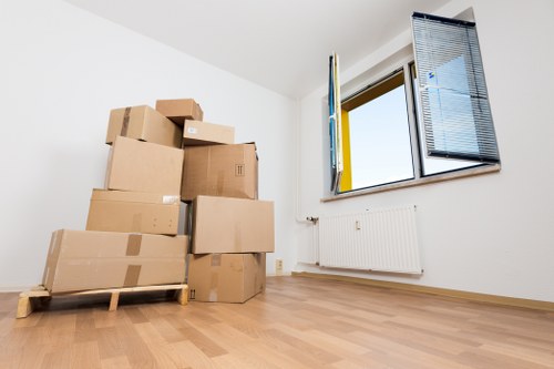 Packed office boxes and furniture prepared for relocation