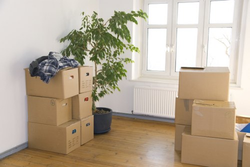 Packed office furniture and labelled boxes ready for a business move