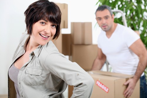 Loading furniture and boxes into a moving truck in Fulham
