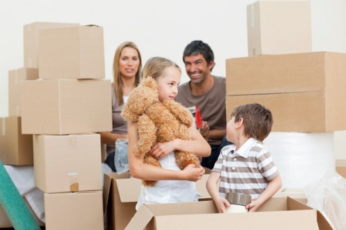 Packed household boxes and furniture for a Fulham move